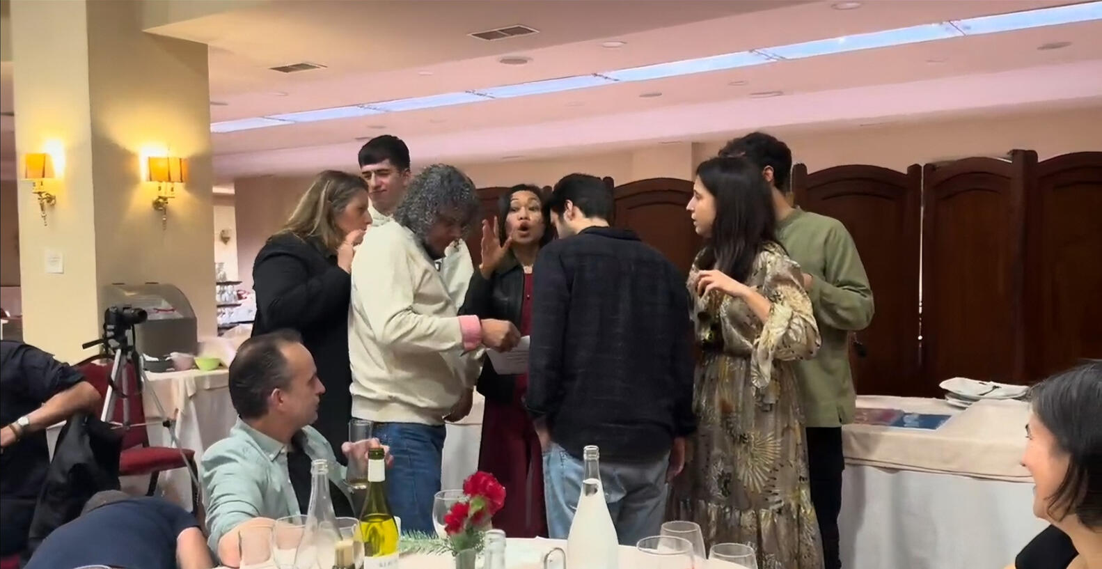 Facilitating games at the dojo Christmas party—in Spanish (her second language). Leadership isn't about being front and center. It's about creating the energy that brings people together. All volunteer work. All done for the community.