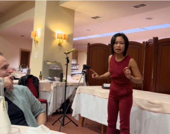 Dojo Christmas party: Performing a Galician monologue (a language she doesn't speak) for a community audience. No theater stage. No professional lighting. Just presence, preparation, and connection.